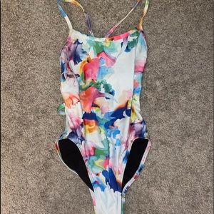 Jolyn Tie-Back Onesie in a fun Colorful Tie-Dye and White print